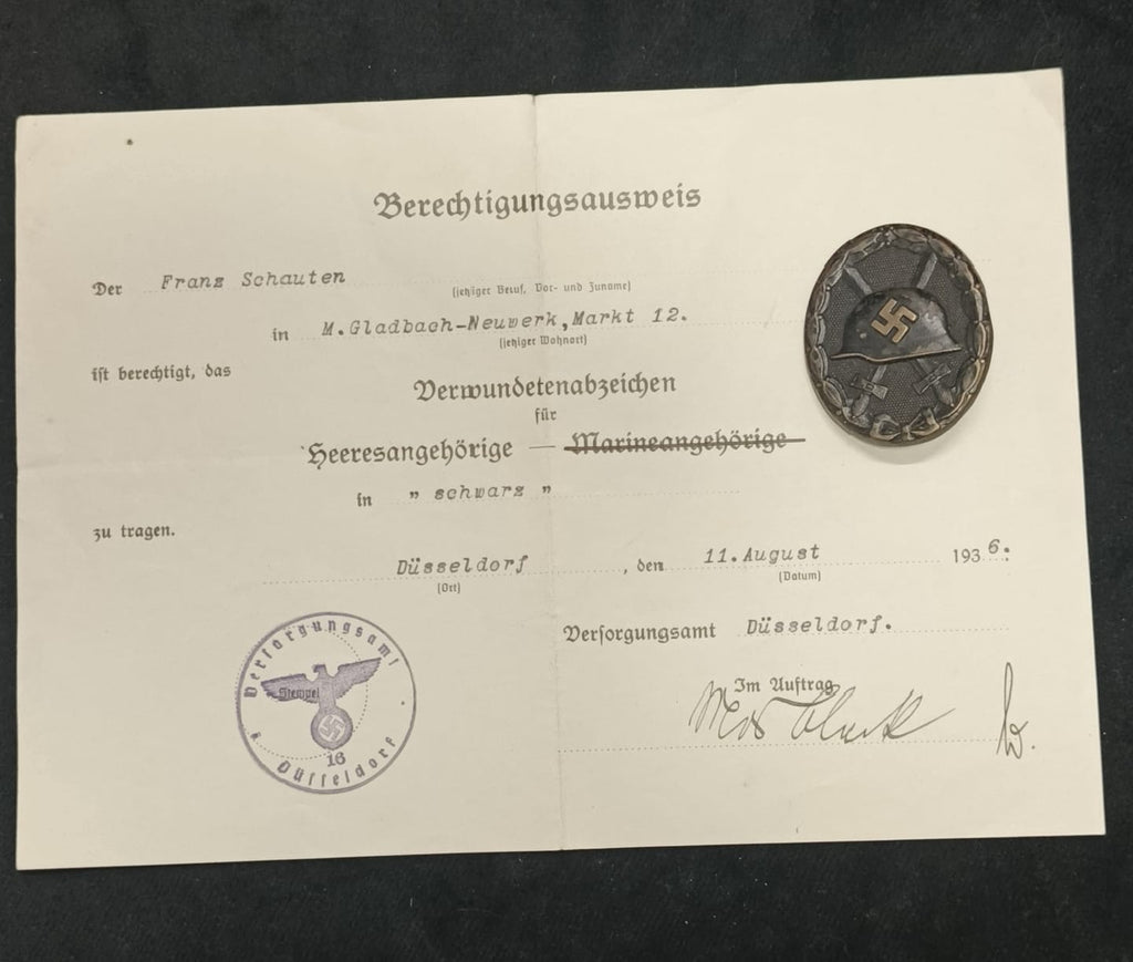 Czarna odznaka za rany, sygnowana "L/11" z nadaniem